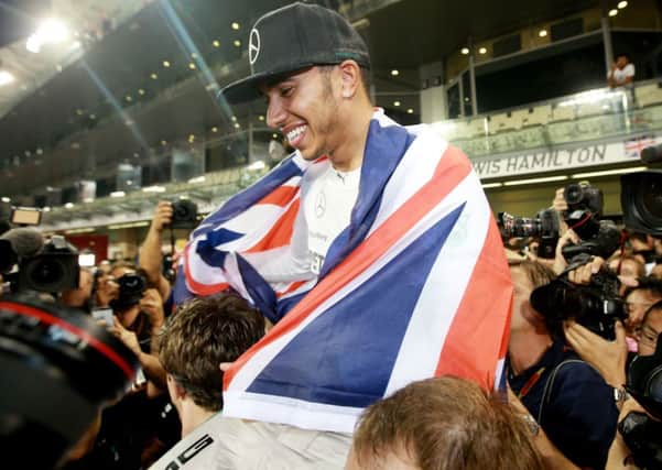 Mercedes Lewis Hamilton celebrates becoming World Champion after victory in the 2014 Abu Dhabi Grand Prix at the Yas Marina Circuit