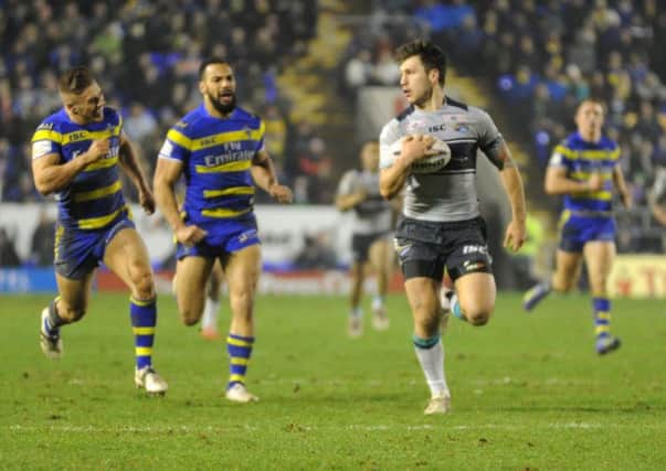 Tom Briscoe scores a consolation try for Leeds Rhinos at Warrington. Picture: Steve Riding.