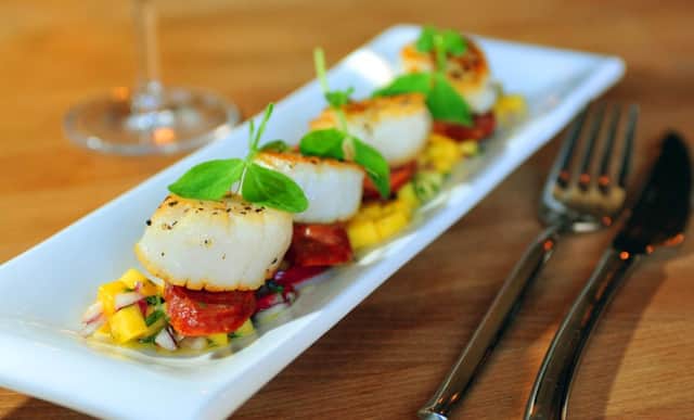 Scallops on Yorkshire chorizo with a mango and chilli salsa. Picture by Tony Johnson