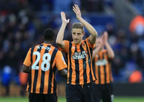 Hull City's Michael Dawson applauds the traveling fans.