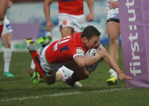 Shaun Lunt dives over for a second-half try for Hull KR against Catalans Dragons.