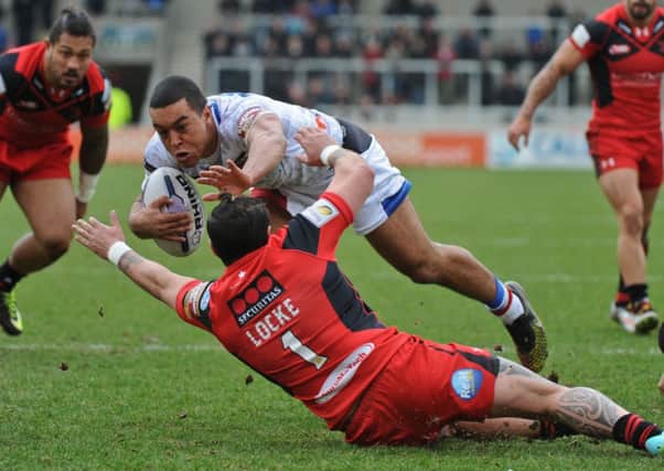 Kevin Locke of Salford Red Devils and Reece Lyne of Wakefield Trinity Wildcats