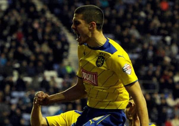Conor Coady, pictured celebrating his winner against Wigan, is certain switch to Huddersfield Town was the right one (Picture: James Hardisty).