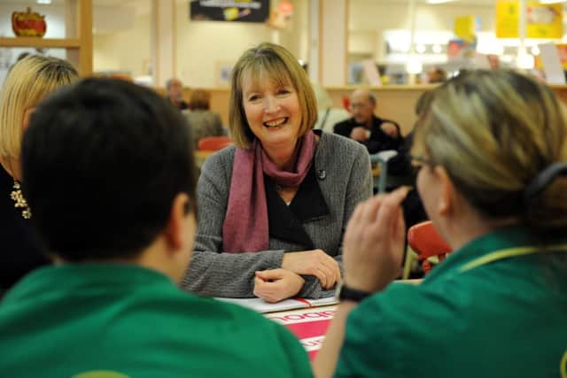 Harriet Harman in Rothwell, Leeds, chatting to staff on her Woman to Woman tour
