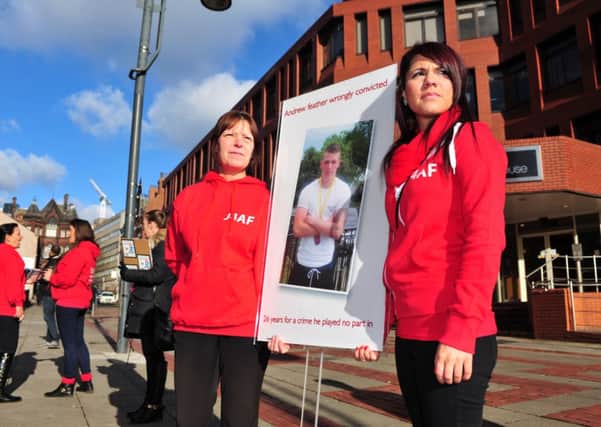 6 February 2015 .......   Michelle Feather and Rebecca Wright, mother and sister of Andrew Feather protest outside Leeds Crown Court along with the families of two other men convicted for the brutal murder of Bradford man Barry Selby. They say Andrew Feather, Joseph Lowther and Robert Woodhead were wrongly convicted under the joint enterprise doctrine.  TJ100704j Picture Tony Johnson