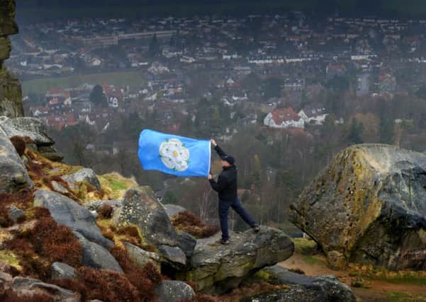 The Yorkshire Flag is raised over the Cow and Calf Rocks, Ilkley. Picture by Simon Hulme