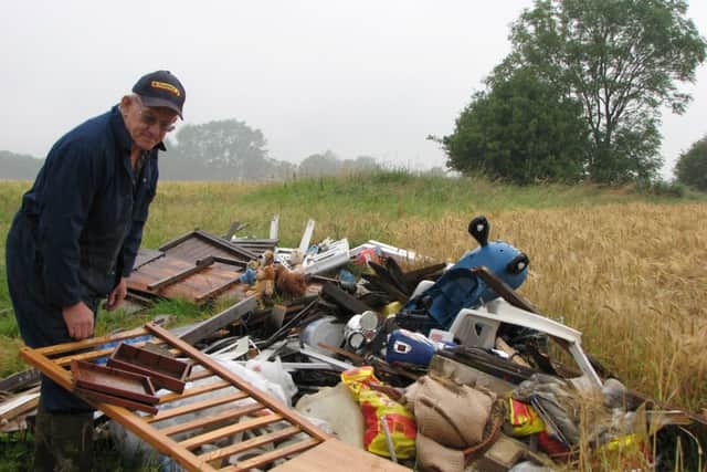 Stokesley famer Robert Campbell with some of the waste that has been dumped on his land
