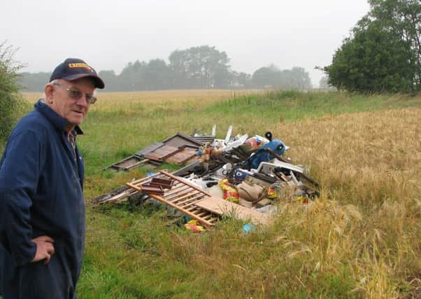 Stokesley famer Robert Campbell with some of the waste that has been dumped on his land