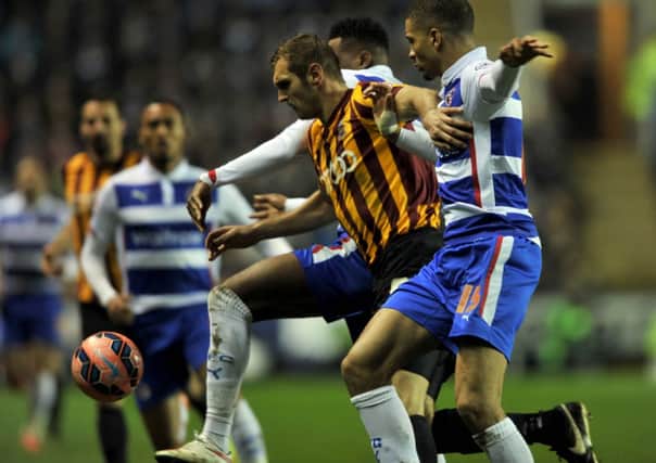 Bradford City's James Hanson is tackled by Reading's Nathaniel Chalobah and Michael Hector during Monday night's FA Cup sixth-round replay (Picture: James Hardisty).