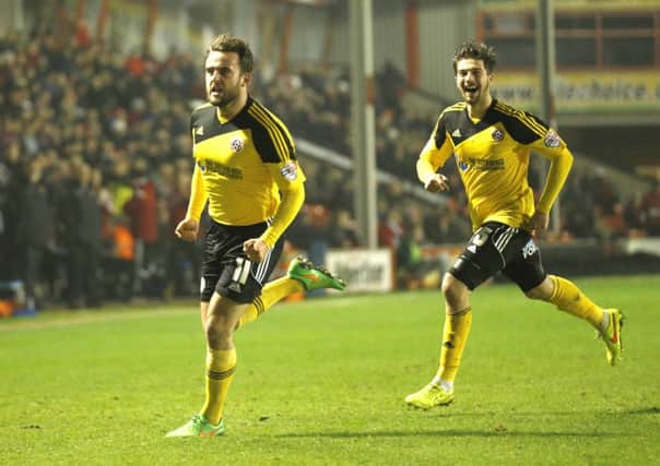 Jose Baxter celebrates his goal against Walsall. Picture: Martyn Harrison.