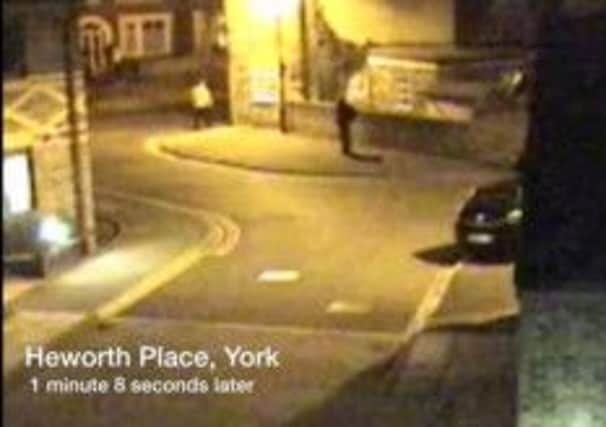 CCTV footage dated 18/03/09 of a man place want to identify (right) leaving Heworth Place, off Heworth Road, a short time later, near the home of missing chef Claudia Lawrence
