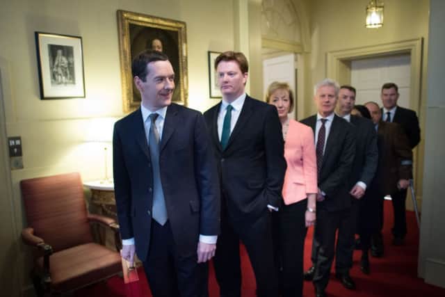 Chancellor George Osborne, Chief Secretary to the Treasury Danny Alexander and their treasury team leave 11 Downing Street