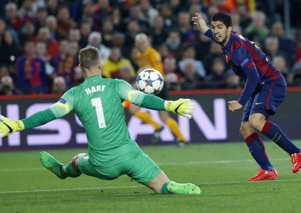 Barcelona's Luis Suarez attempts to score past Manchester City's goalkeeper Joe Hart (AP Photo/Emilio Morenatti)