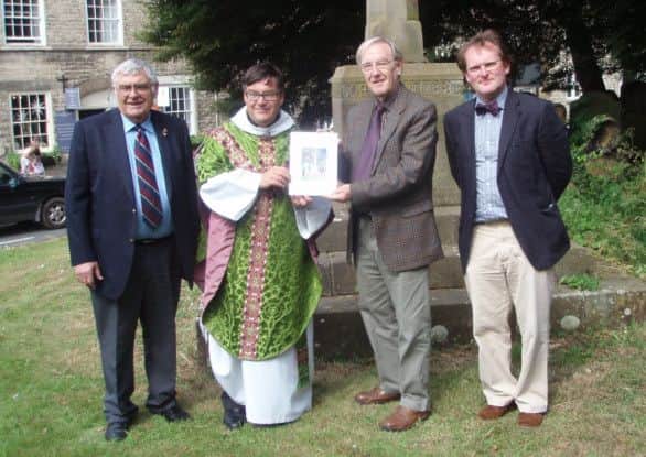 The presentation of the Helmsley War Memorial book.
Pictured, from left: 
Geoff Otterburn, secretary of the Ryedale Damily History Group; 
Rev Tim Robinson, vicar of Helmsley
'Peter Braithwaite, chairman of the Group and Jake Duncombe