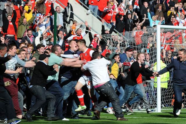 Rotherham United's Lee Frecklington is mobbed after scoring the goal that got the Millers up into League One.