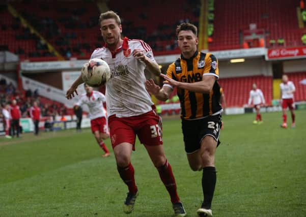 Sheffield United's Steve Davies and Vale's  Frederic Veseli battle for the ball.