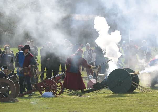Reenactors fire a 21 gun salute during a service as part of the Richard III reburial at Bosworth Battlefield in Nuneaton, Warwickshire.