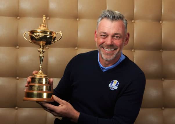 European Ryder Cup captain Darren Clarke holds the Ryder Cup trophy during Monday's media day (Picture: John Walton/PA Wire).