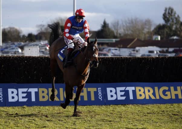 Rocky Creek, ridden by Sam Twiston-Davies, jumps the last fence to win the BetBright Steeple Chase at Kempton (Picture: Steve Parsons/PA Wire).