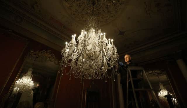 Embargoed to 0001 Thursday March 26

Conservator Robin Matthews  removes the dust from a chandelier  at English Heritage property Brodsworth Hall, as English Heritage prepare for the annual opening of their properties across the country. PRESS ASSOCIATION Photo. Picture date: Thursday March 19, 2015. See PA story HERITAGE England. Photo credit should read: Lynne Cameron/PA Wire