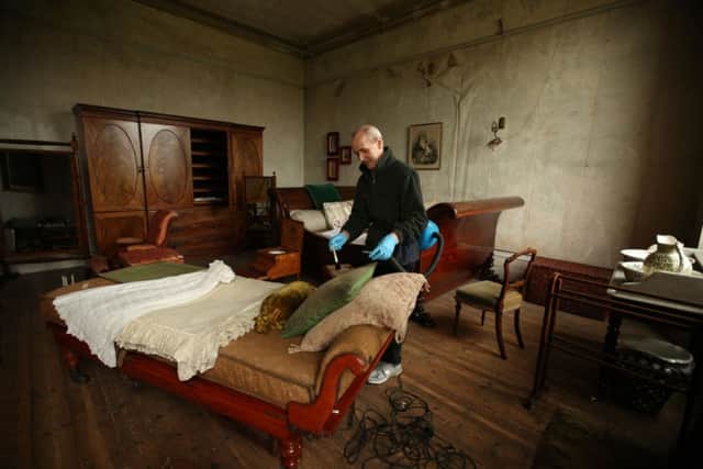 Embargoed to 0001 Thursday March 26

Conservator Robin Matthews carefully removes dust in the principle guest bedroom at English Heritage property Brodsworth Hall, as English Heritage prepare for the annual opening of their properties across the country. PRESS ASSOCIATION Photo. Picture date: Thursday March 19, 2015. See PA story HERITAGE England. Photo credit should read: Lynne Cameron/PA Wire