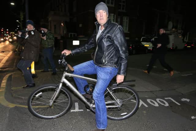 Jeremy Clarkson leaves his home in west London on a bicycle