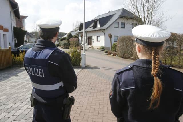 Police hold media away from the house where Andreas Lubitz lived in Montabaur, Germany