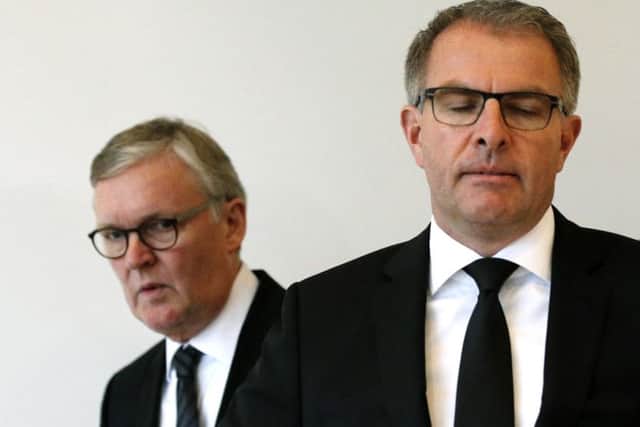 Lufthansa CEO Carsten Spohr, right, and Germanwings CEO Thomas Winkelmann arrive for a press conference near the Germanwings headquarters in Cologne, Germany