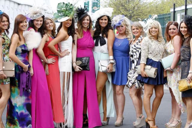 Racegoers during Ladies Day at Aintree Racecourse. 
Photo: Peter Byrne/PA Wire