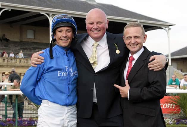 Graham Orange of Go Racing In Yorkshire (centre) with jockeys Frankie Dettori (left) and Kevin Darley