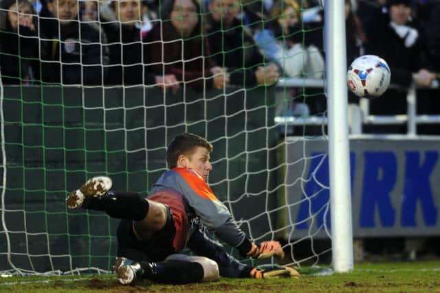 United's Adam Nicklin saves in the penalty shoot out with Bath City. (
Picture: Jonathan Gawthorpe).