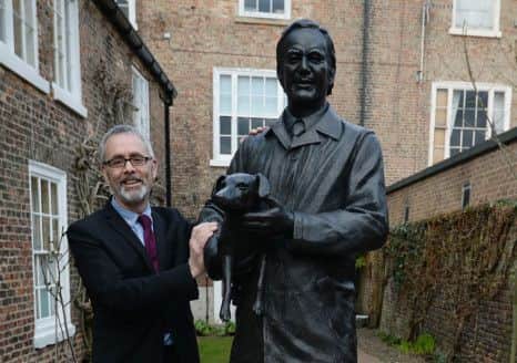 James Berresford, chief executive of Visit England with a new statue of Alf Wight at the James Herriot museum in Thirsk.
Picture by Nigel Roddis