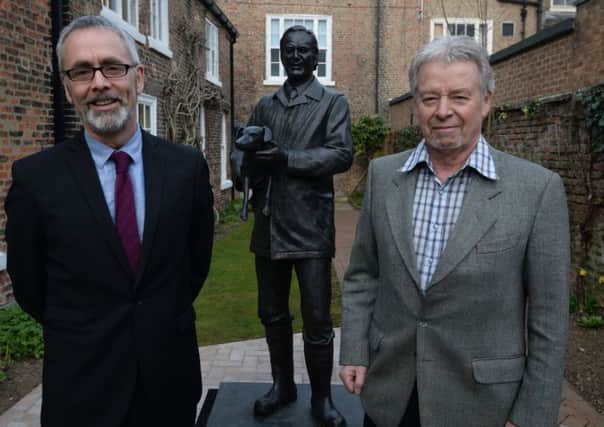 James Berresford, chief executive of Visit England (left) and Jim Wight with a new statue of his father at the James Herriot museum in Thirsk. Picture by Nigel Roddis