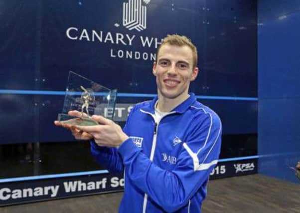 Nick Matthew celebrates his fifth Canary Wharf Classic title in London on Friday night. Picture courtesy of squashpics.com