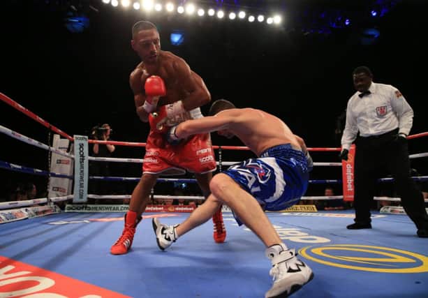Kell Brook knocks down Jo Jo Dan during the IBF World Welterweight Championship bout at the Motorpoint Arena, Sheffield.  Picture: Nick Potts/PA.