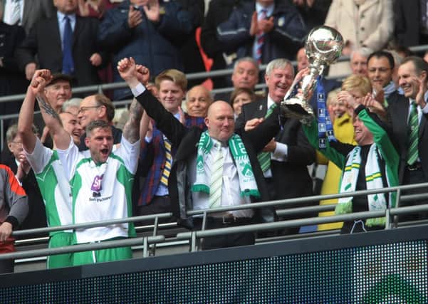 North 
Ferriby's players and manager Billy Heath celebrate winning the FA Trophy at Wembley on Sunday. Picture: Jonathan Gawthorpe.