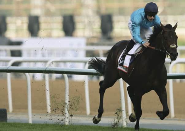 Brown Panther, ridden by Richard Kingscote, wins the Dubai Gold Cup