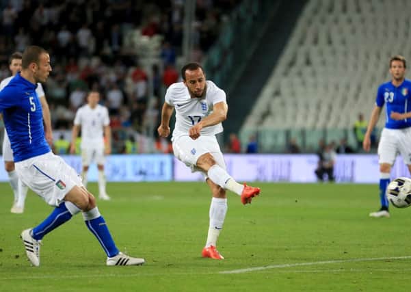 England's Andros Townsend fires in his side's equalising goal against Italy in Turin. Picture: Mike Egerton/PA.