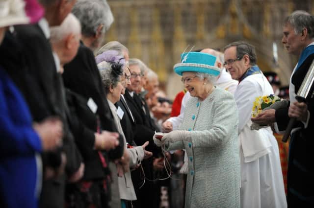 The Queen hands out Maundy money at York Minster in 2012. Picture by Simon Hulme