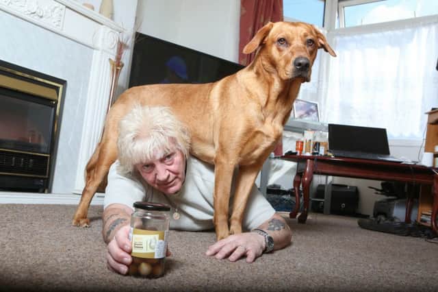 Alan Spencer's dog saved his life by jumping on his back when he passed out after choking on a pickled onion. Picture: Ross Parry Agency