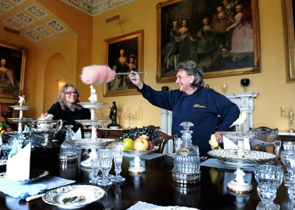 Sam Craven (left) and Trish Sidebottom dusting in the dining room at Newby Hall.