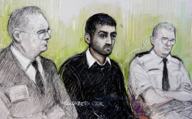 Court sketch of British law student  Erol Incedal (centre) who was cleared of plotting a terror attack following the UK's first secret terror case but faces up to 10 years in jail for possessing a bomb-making manual.