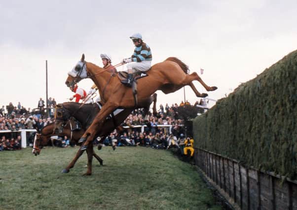 Eventual 1975 Grand National winner L'Escargot ridden by Tommy Carberry (4) jumps Beechers Brook. (Picture: The Grand National 1975

Sport)
