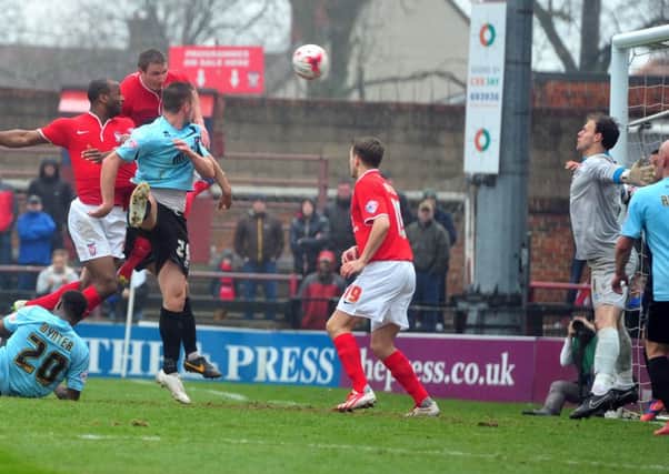 Dave Winfield rises to head home the only goal of the game which enabled York City to beat Cheltenham (Picture: Tony Johnson).