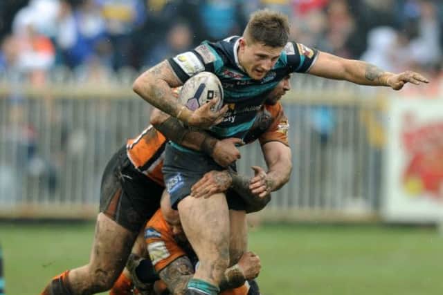 Liam Sutcliffe is held by Castleford Tigers