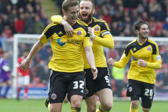 1
Steven Davies celebrates after putting Sheffield United ahead at Oakwell. (

Picture by Dean Atkins)