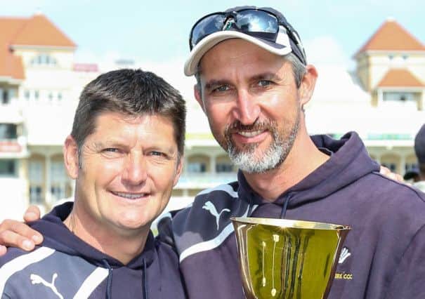 Yorkshire Director of Cricket Martyn Moxon and First Team Coach Jason Gillespie celebrate with the 2014 trophy.
