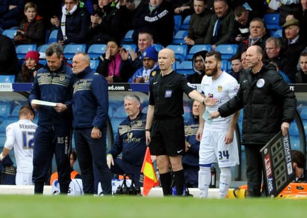 Neil Redfearn ponders his options as Mirco Antenucci, the striker the Leeds board did not want to feature, waits to enter the fray against Blackburn Rovers (Picture: Bruce Rollinson).