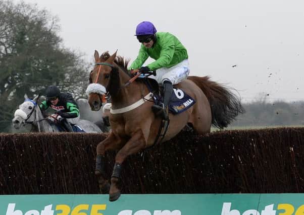 Dolatulo ridden by Dougie Costello clears the final fence to win the William Hill Rowland Merrick Handicap Steeple Chase at Wetherby. (Picture: Anna Gowthorpe/PA Wire).