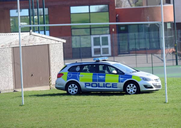 Police near the scene of the attack at King James's School